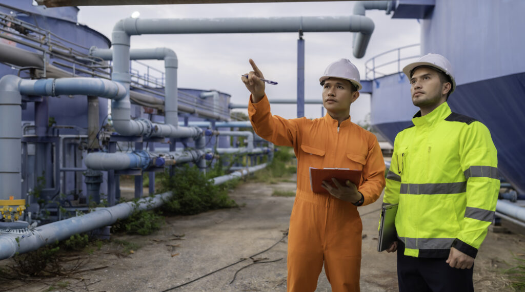 engineer technician maintenance checking technical data system equipment condenser water pump pressure gaugeenvironmentalist working water supply