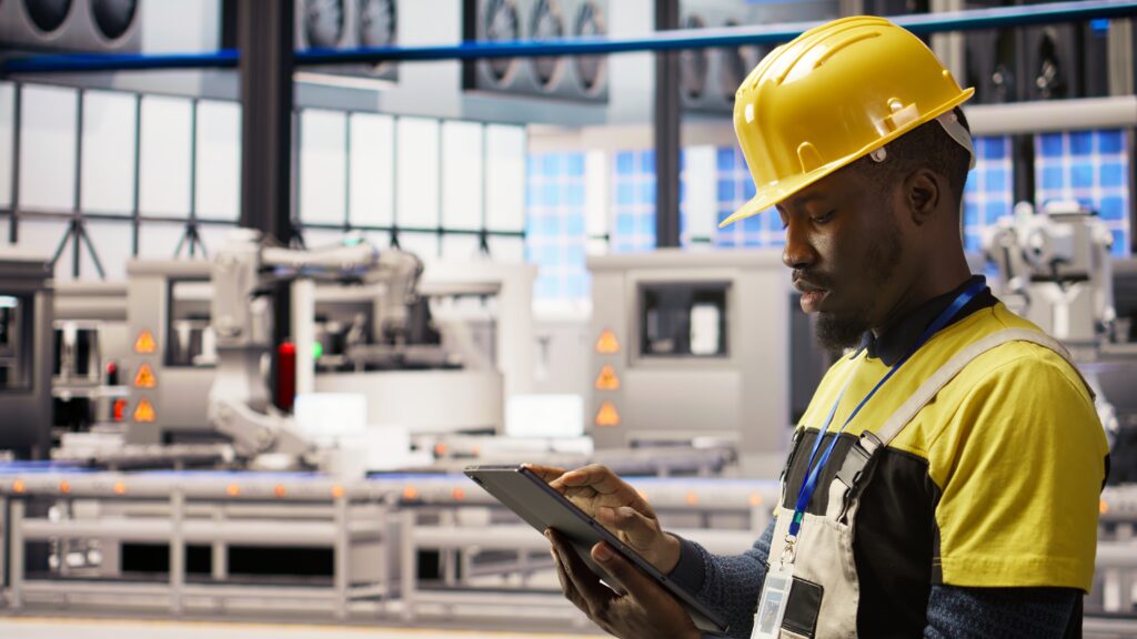 smart factory specialist testing automated systems, monitoring operations